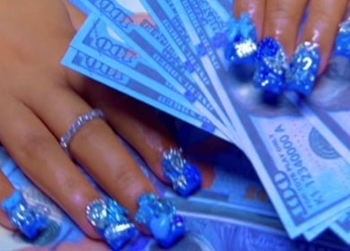 Intricate blue nails with jewels at PurpLust Nails, Hazelwood, Missouri, US.