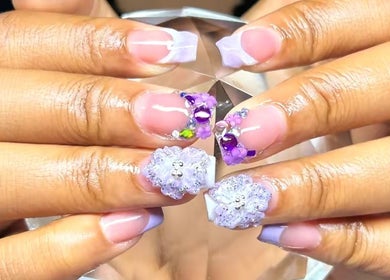 Intricate floral nail art from PurpLust Nails in Hazelwood, Missouri, US, showcasing elegant purple accents.