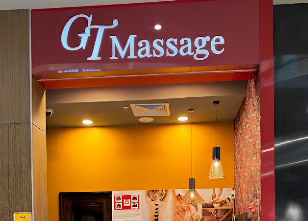 GT Massage venue entrance in Joondalup, Western Australia, featuring bright yellow walls.