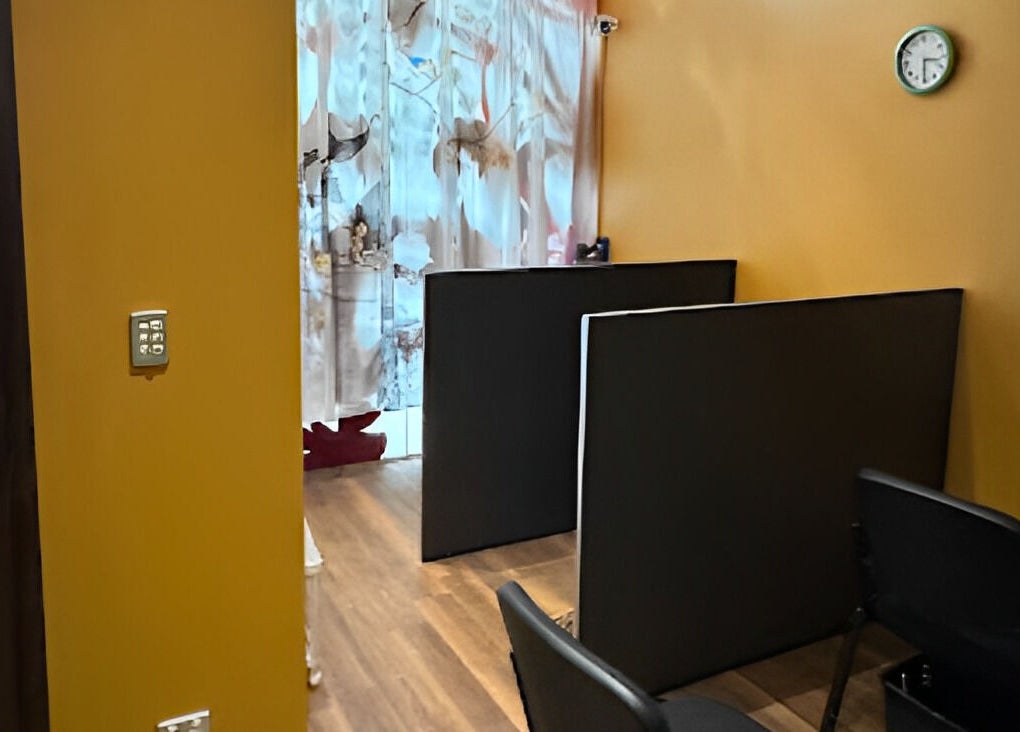 Cozy massage area at GT Massage in Joondalup, Western Australia, AU with amber walls and peaceful decor.