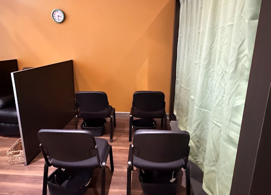 GT Massage waiting area with chairs and cozy decor, Joondalup, Western Australia, AU.