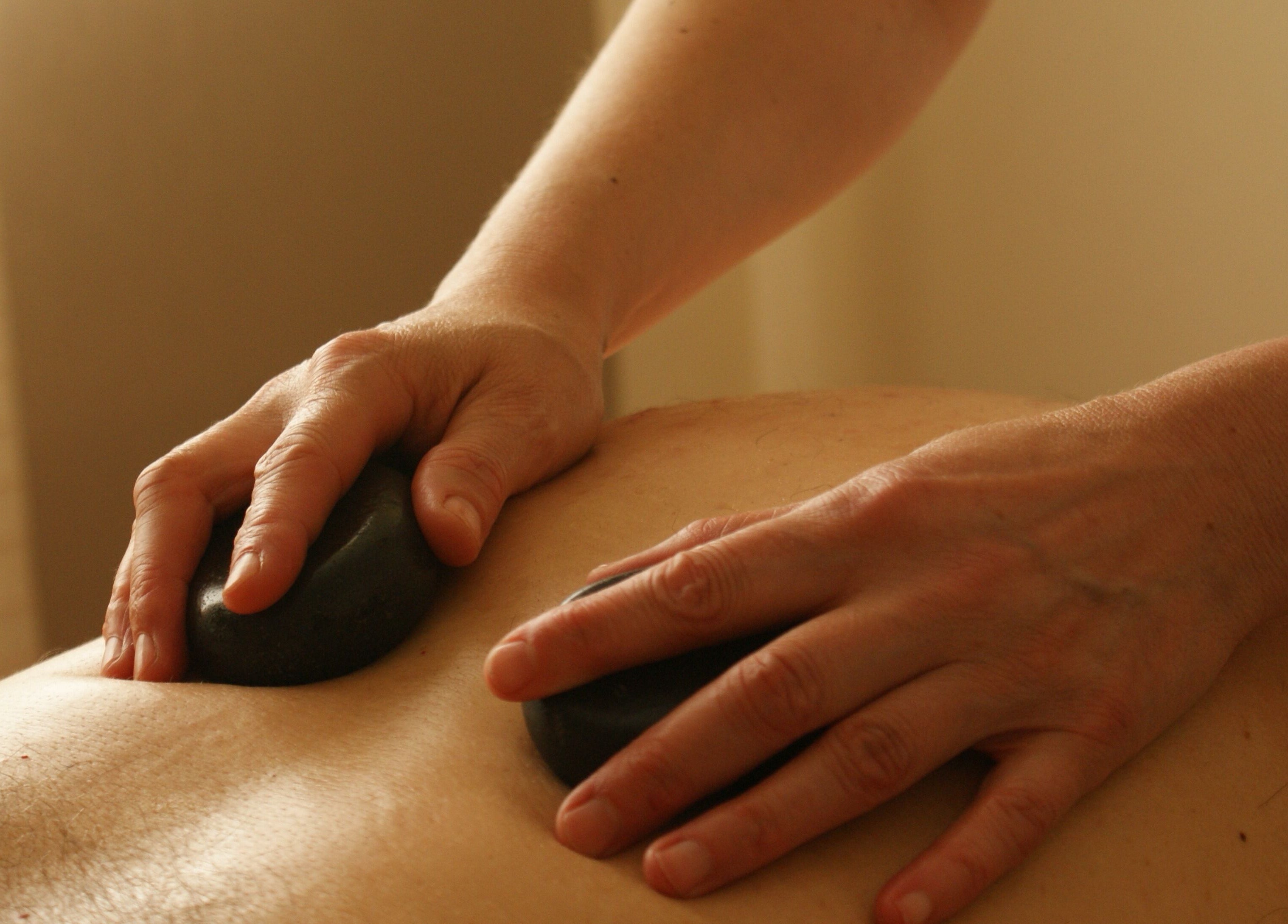 Hot stone massage therapy at Manor Farm Spa - Wellness Lounge, Thorpe Audlin, England, GB.