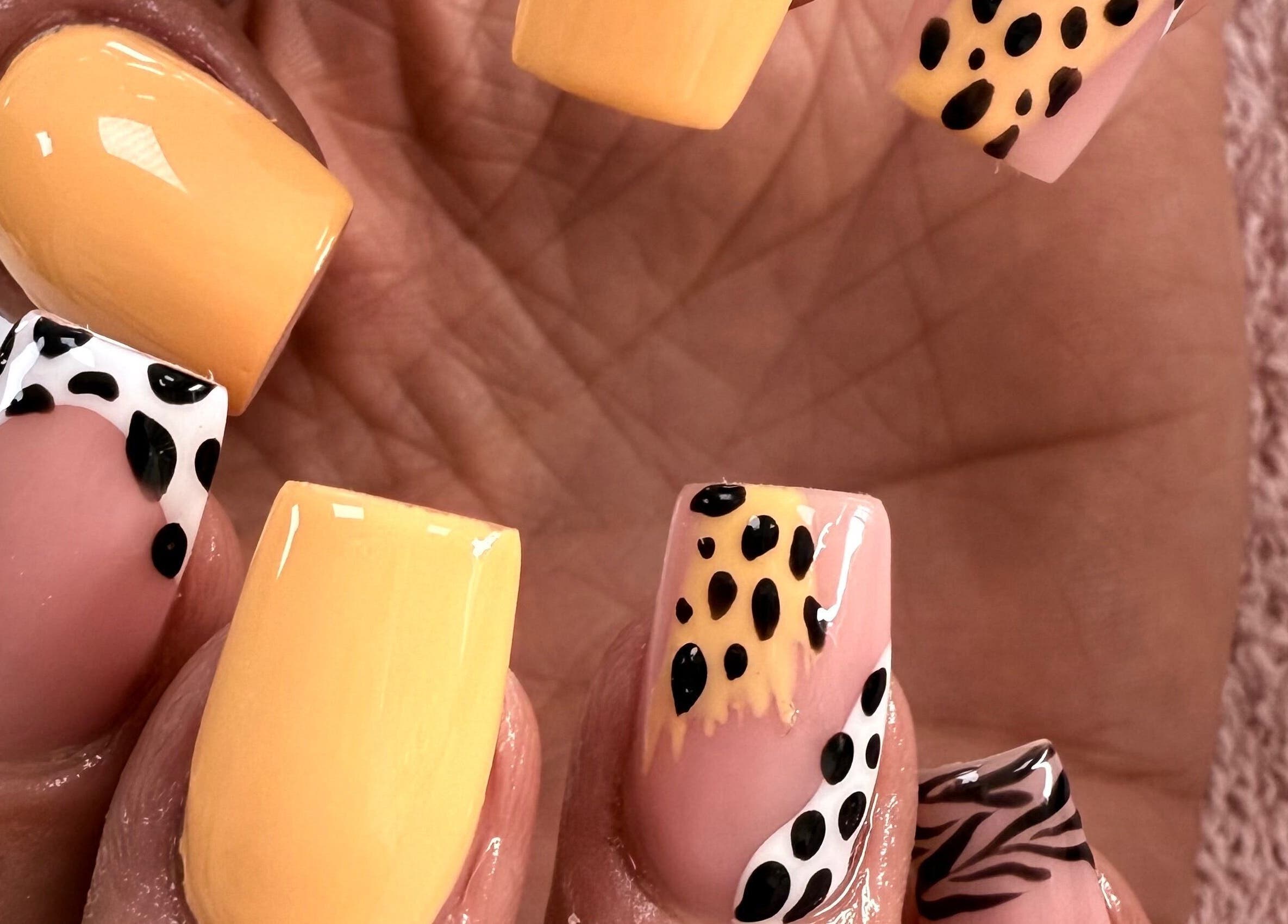 Stylish leopard print nail art at KC Butterflies, Armthorpe, England, GB.