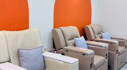 Relaxing pedicure chairs at Shimmer & Shine at northpoint, Singapore, Singapore, SG with cozy cushions.