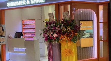 Entrance of Shimmer & Shine at northpoint adorned with vibrant flowers in Singapore, Singapore, SG.