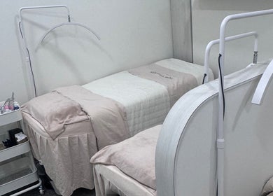 Relaxing treatment room at Shimmer and Shine, Kovan Heartland Mall, Kovan, SG with cozy beds and equipment.