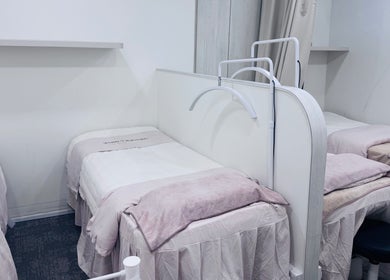 Calming treatment beds at Shimmer and Shine at Kovan Heartland Mall, Kovan, SG, offering a tranquil spa experience.