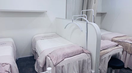 Calming treatment beds at Shimmer and Shine at Kovan Heartland Mall, Kovan, SG, offering a tranquil spa experience.