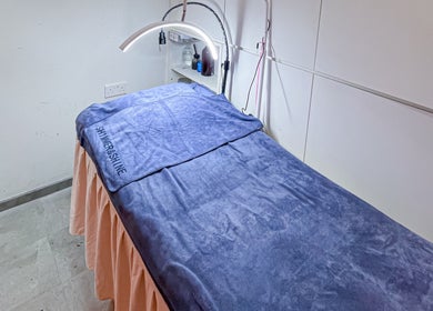 Cozy spa treatment bed at Shimmer & Shine, Northpoint, Singapore, Singapore, SG with relaxing blue blanket.