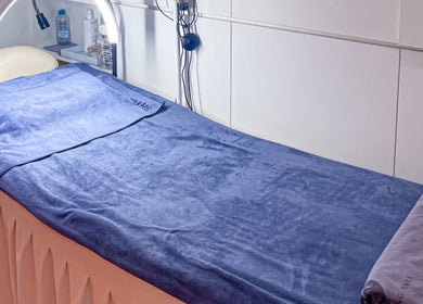 Luxurious treatment bed at Shimmer & Shine at Northpoint, Singapore, SG. Experience relaxing wellness treatments.