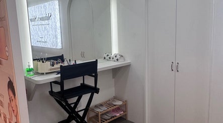 Makeup station at Shimmer and Shine, Kovan Heartland Mall, SG, with chair, products, and vanity mirror.