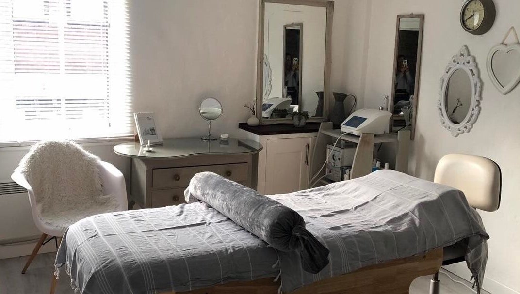 Tranquil beauty room at Enhanced, Worcester, England, GB, featuring a cozy treatment bed and elegant decor.