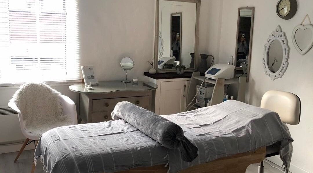 Tranquil beauty room at Enhanced, Worcester, England, GB, featuring a cozy treatment bed and elegant decor.