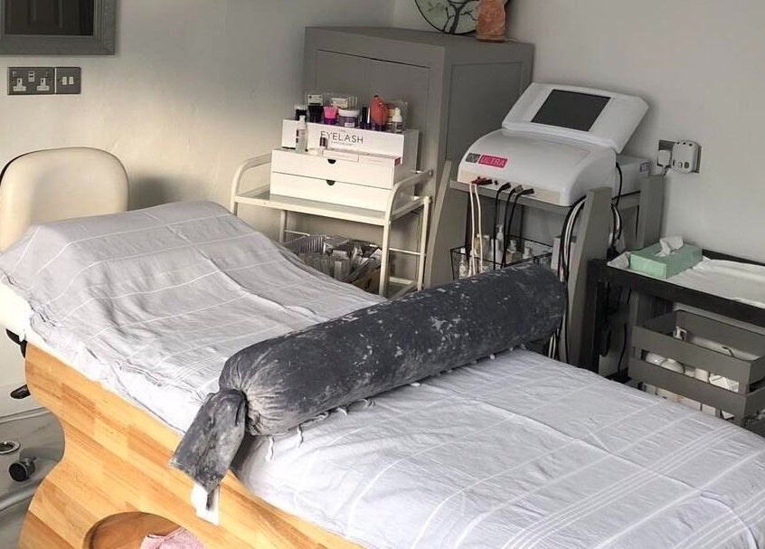 Massage therapy room at Enhanced, Worcester, England, GB, featuring a treatment table and soothing decor.