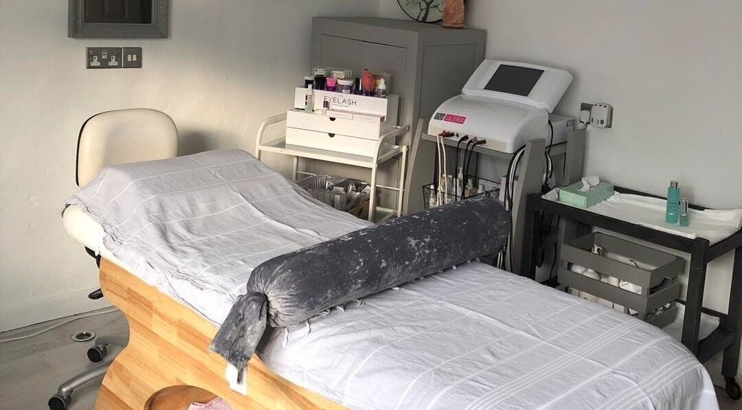 Massage therapy room at Enhanced, Worcester, England, GB, featuring a treatment table and soothing decor.