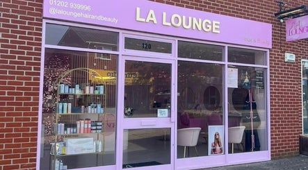HairbyIssy Howard's stylish salon entrance in Ferndown, England, GB with modern signage and product display.