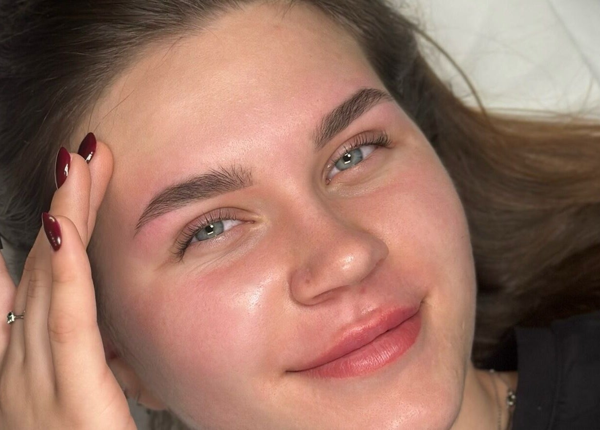 Relaxed woman with clear skin after treatment at Anastasia Shliakhtina, Limerick, County Limerick, IE.