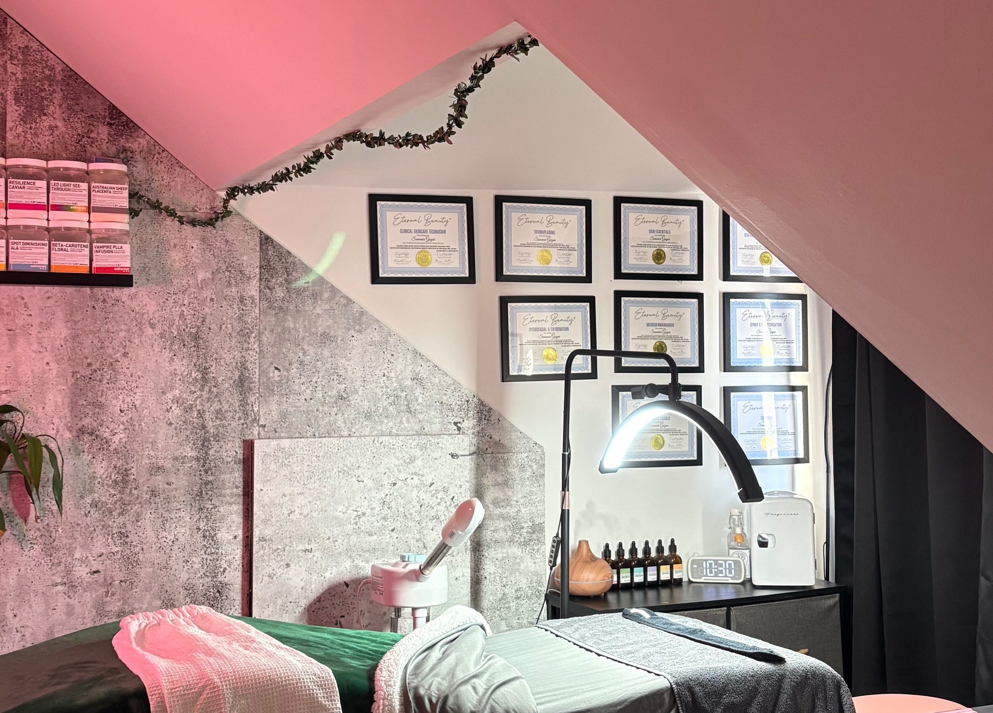 Cozy skincare room at Skin by Summar, Selkirk, Manitoba, CA with products and certificates on display.