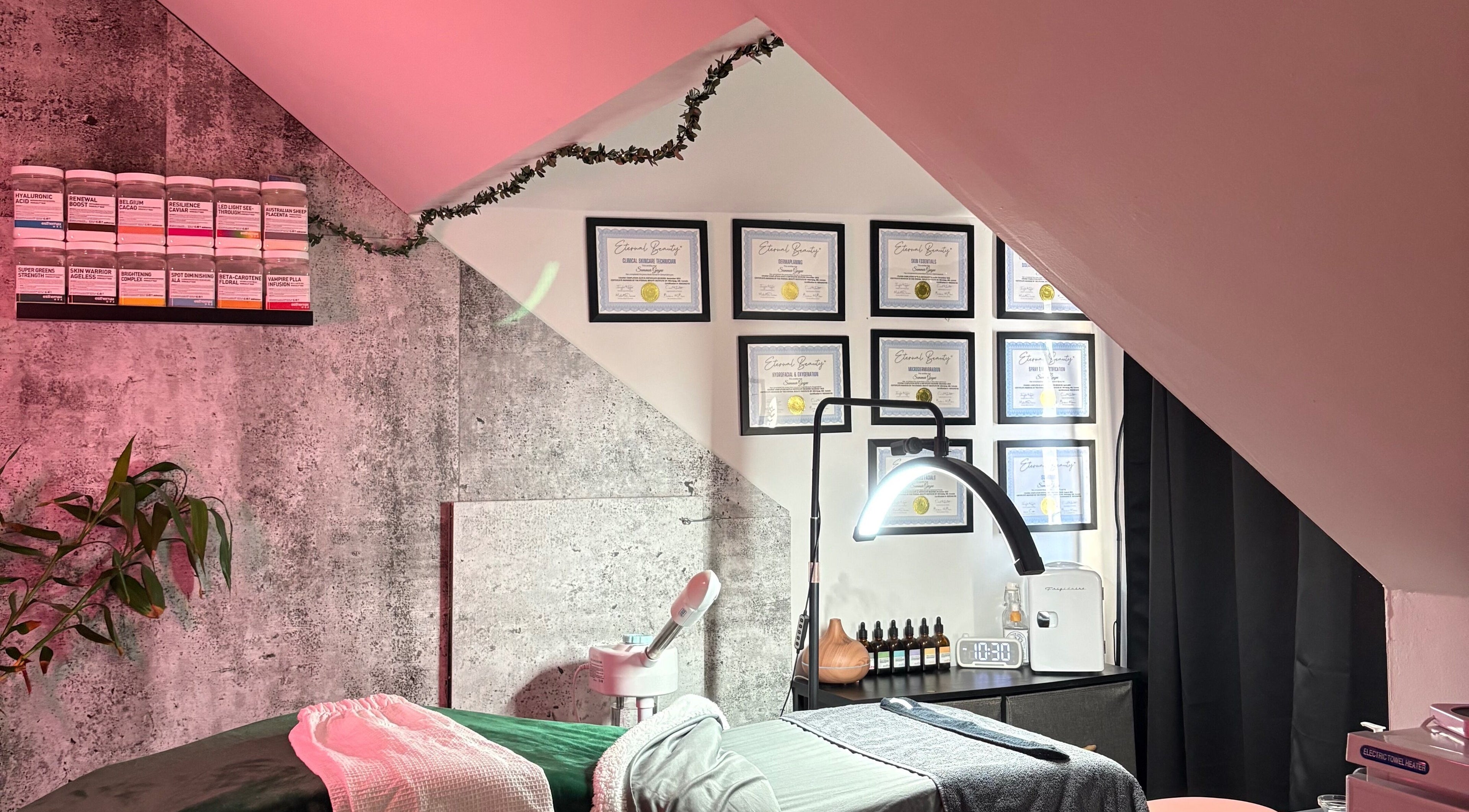 Cozy skincare room at Skin by Summar, Selkirk, Manitoba, CA with products and certificates on display.