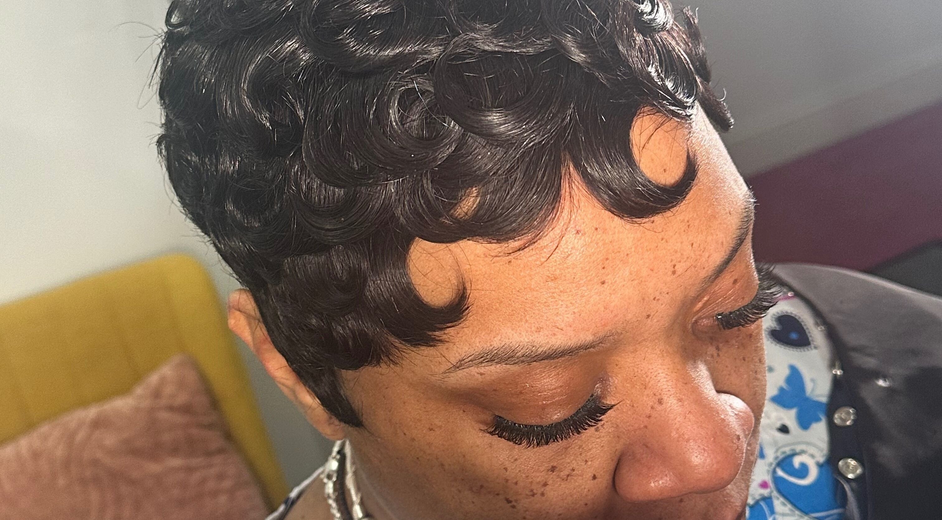Close-up of a stylish, curled hairstyle at A.Tanae in Dayton, Ohio, US, showcasing hair artistry.