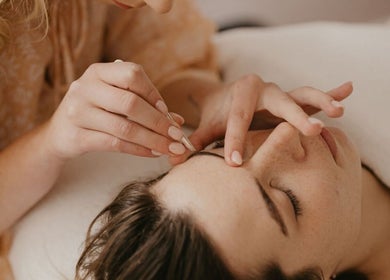 Skincare therapy at Aurelia Skin Therapies, Napier, Hawke's Bay, NZ with gentle touch on a relaxed client.