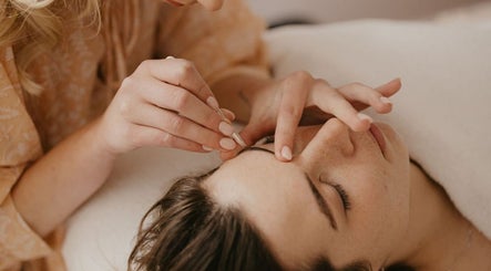 Skincare therapy at Aurelia Skin Therapies, Napier, Hawke's Bay, NZ with gentle touch on a relaxed client.