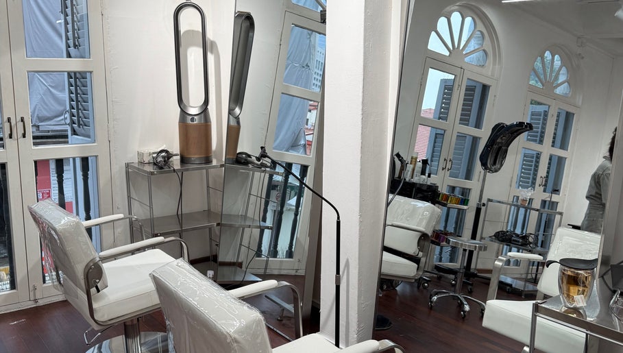 Modern styling chairs and mirrors at August Hair Salon, Singapore, Singapore, SG, offering a chic ambiance.
