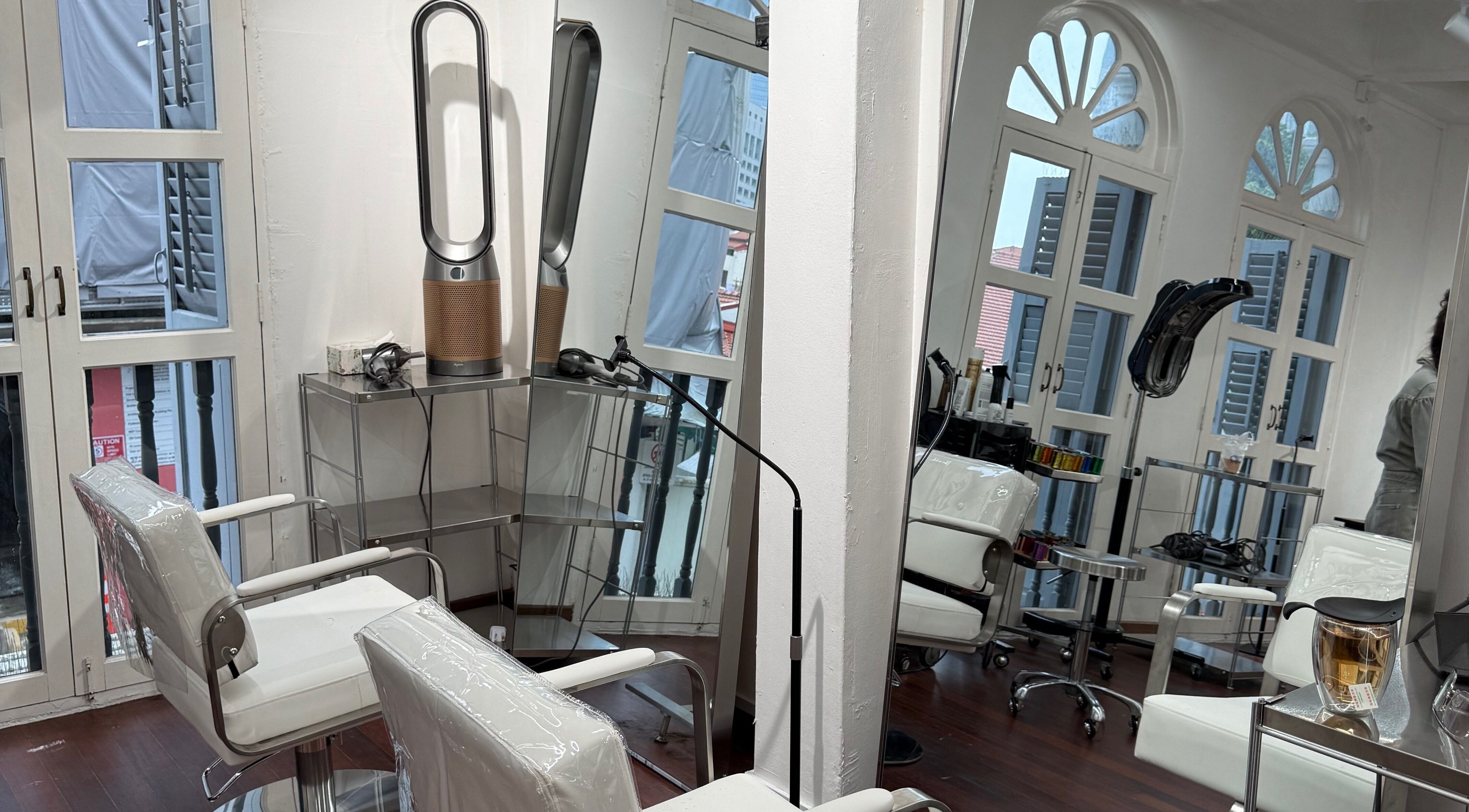 Modern styling chairs and mirrors at August Hair Salon, Singapore, Singapore, SG, offering a chic ambiance.