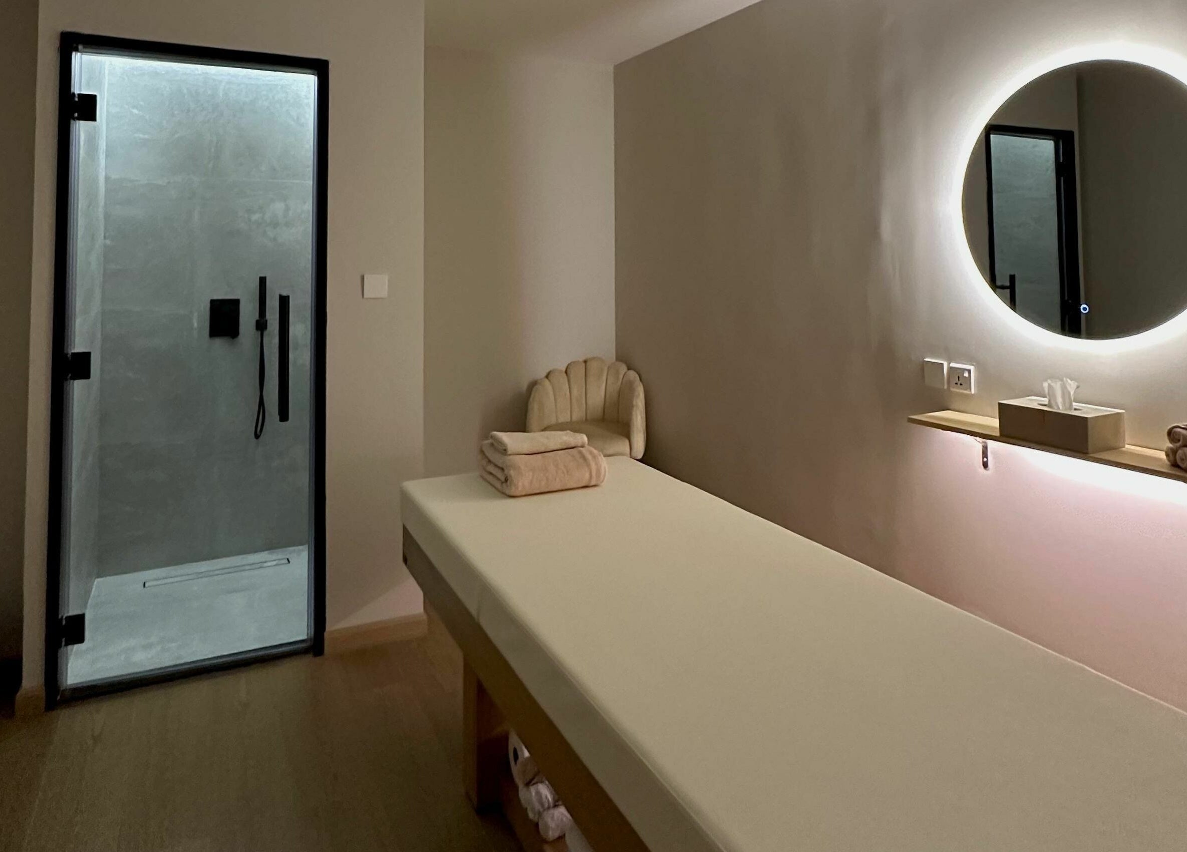 Serene massage room at Regina Spa Dubai (First Spa), Dubai, AE, featuring a sleek modern design.