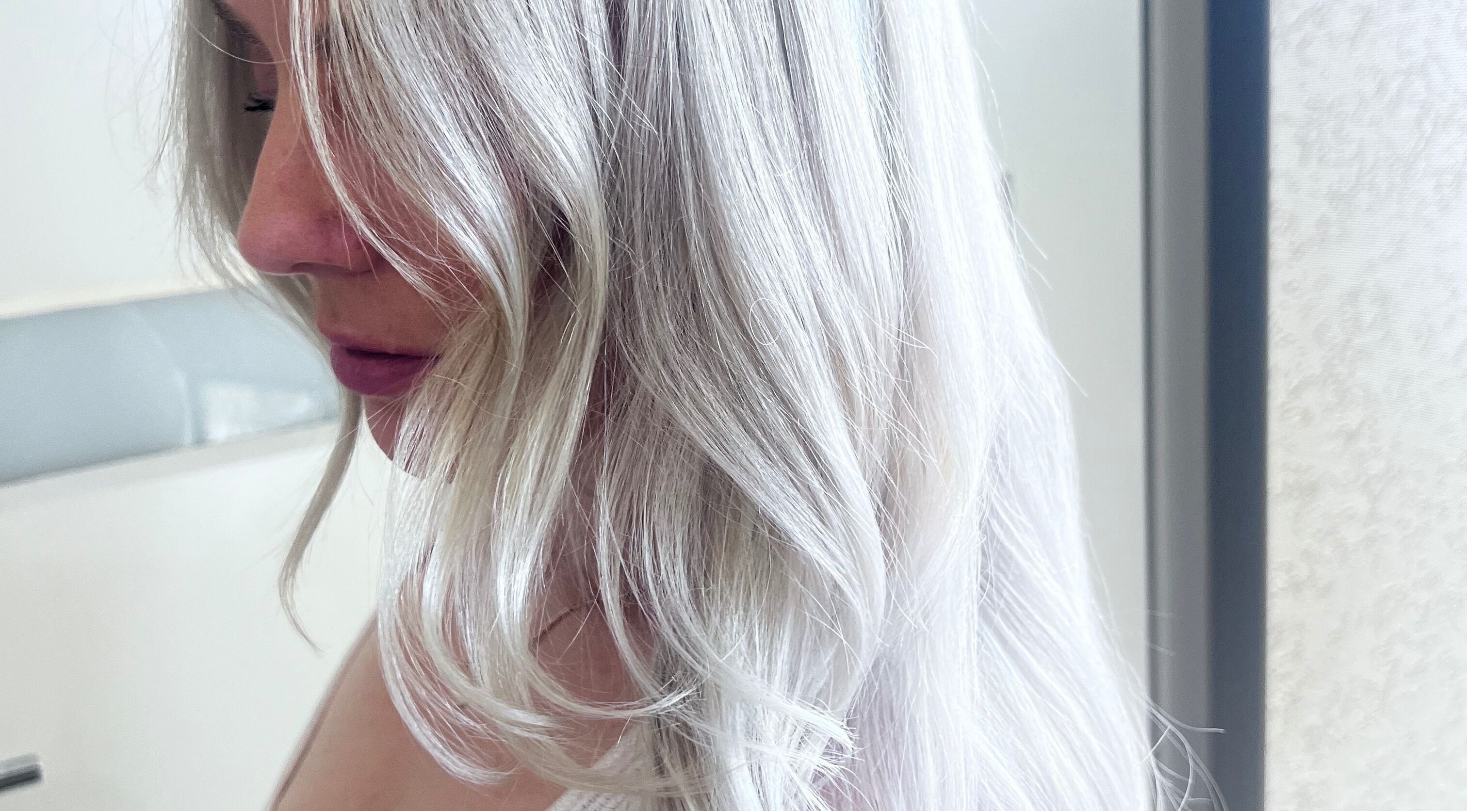 Beautiful silver hair styled at Sal’s Hair, Mount Peter, Queensland, AU, showcasing elegant blonde waves.