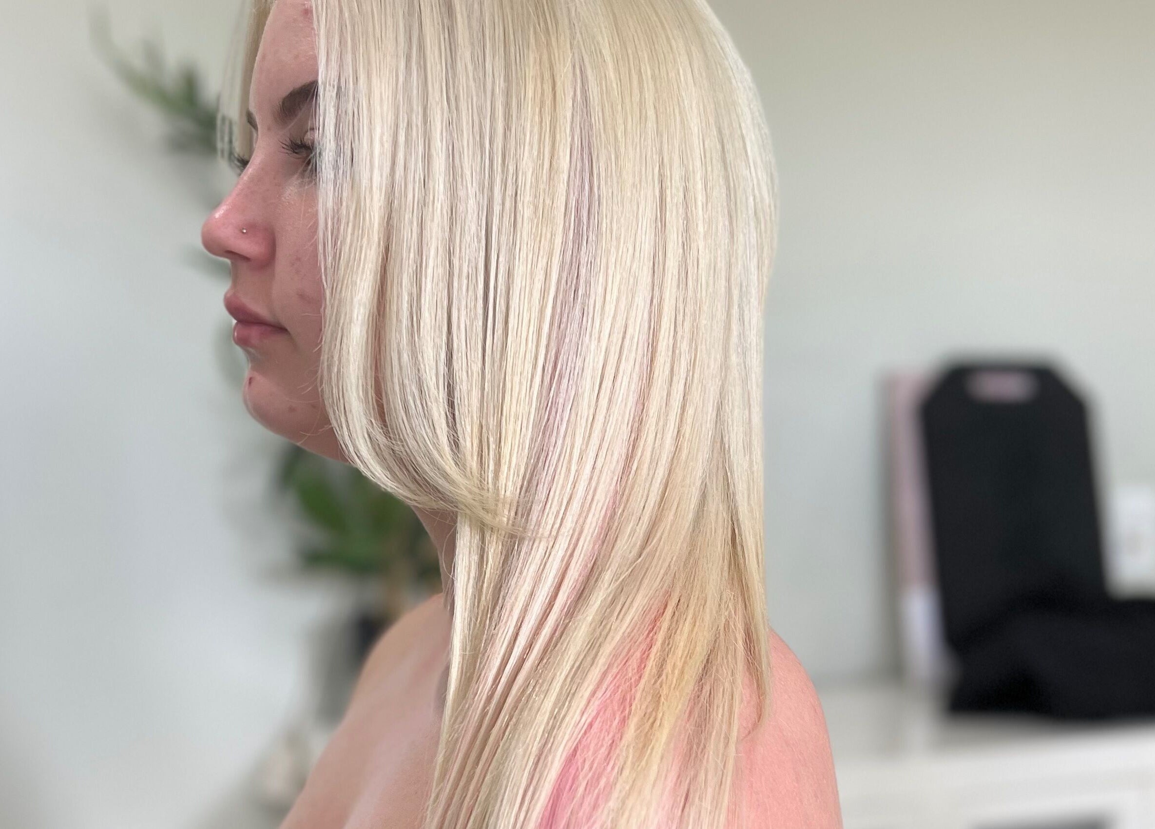 Profile of sleek blonde hair styled at Sal's Hair in Mount Peter, Queensland, AU.