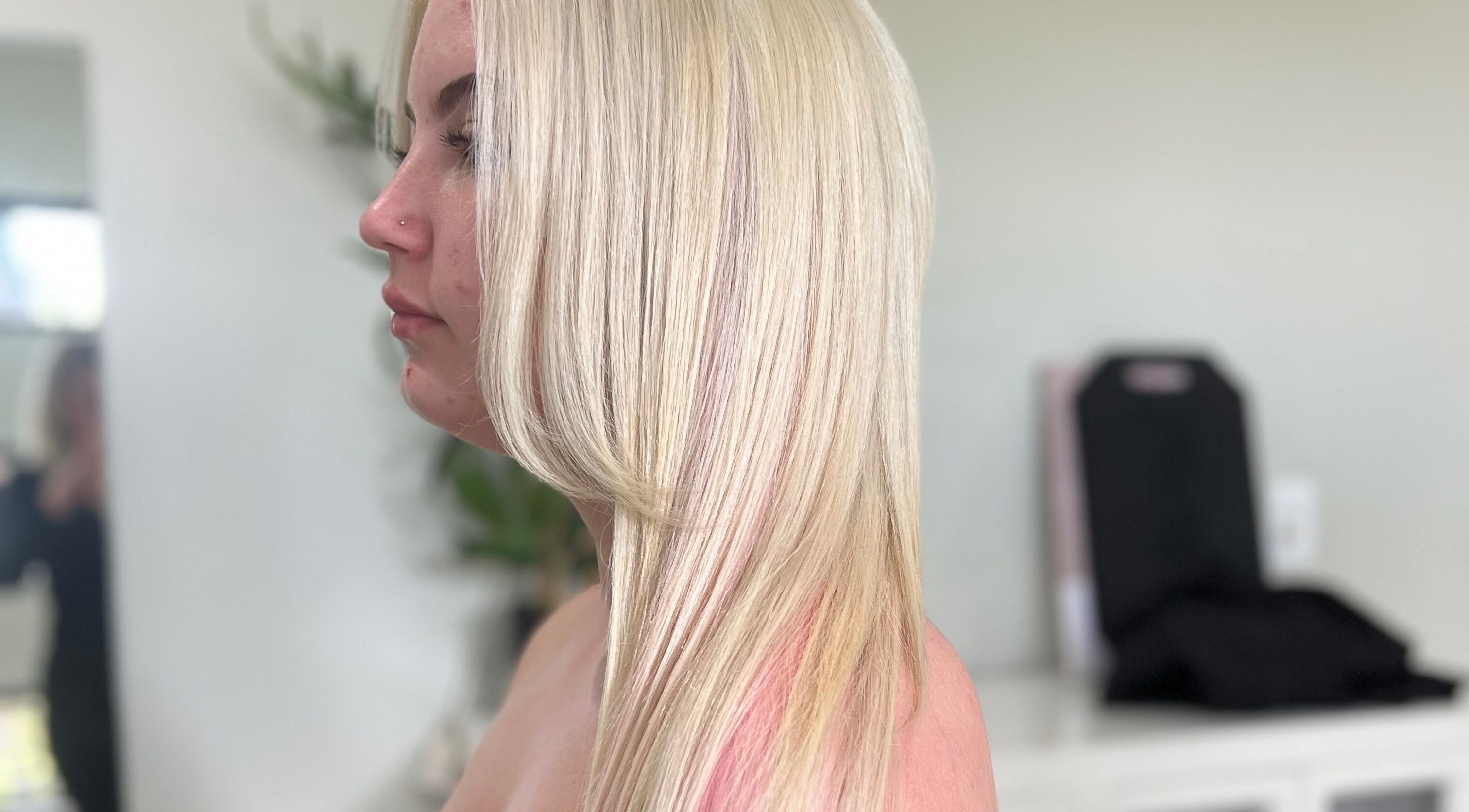 Profile of sleek blonde hair styled at Sal's Hair in Mount Peter, Queensland, AU.