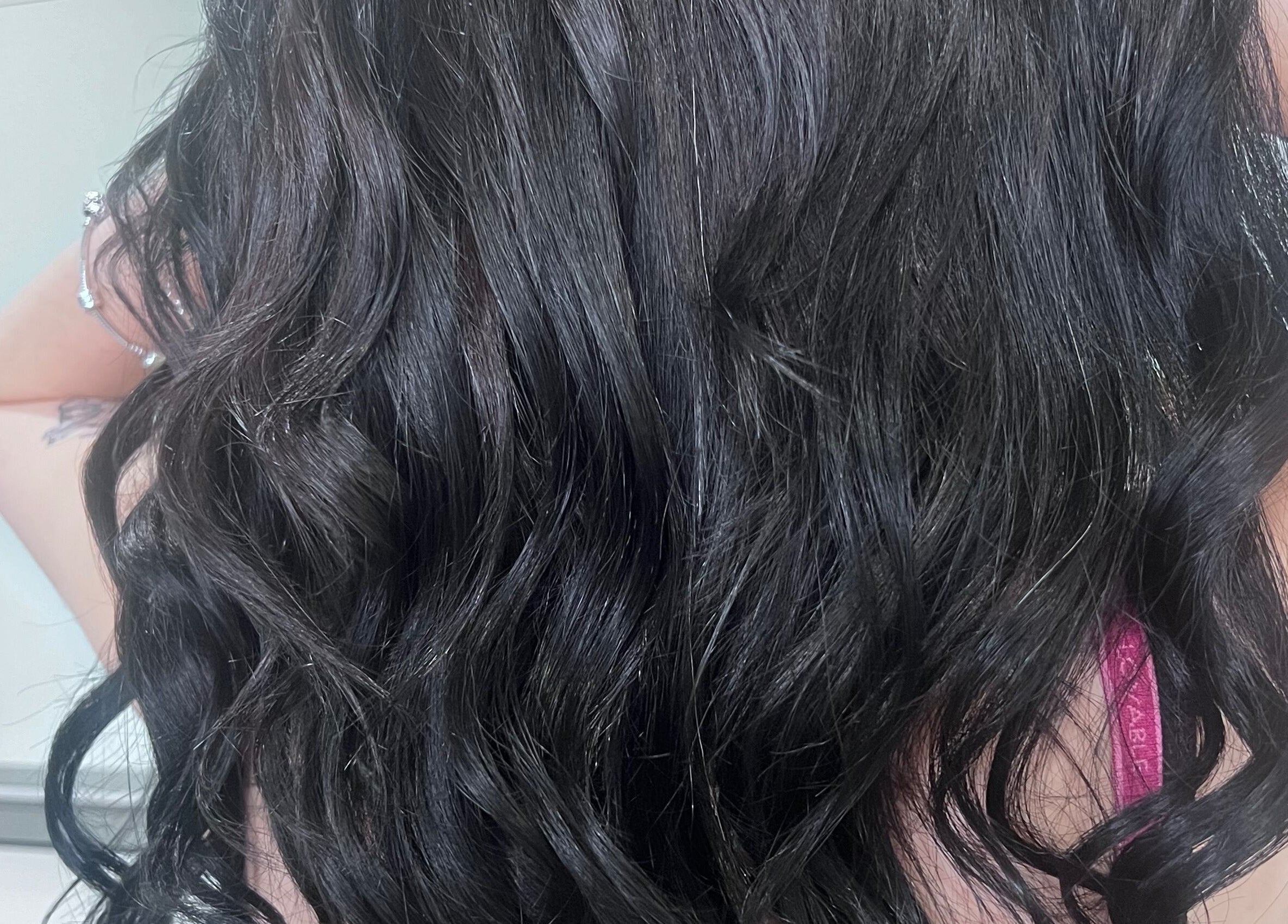 Wavy black hair styled at Sal’s Hair, Mount Peter, Queensland, AU.