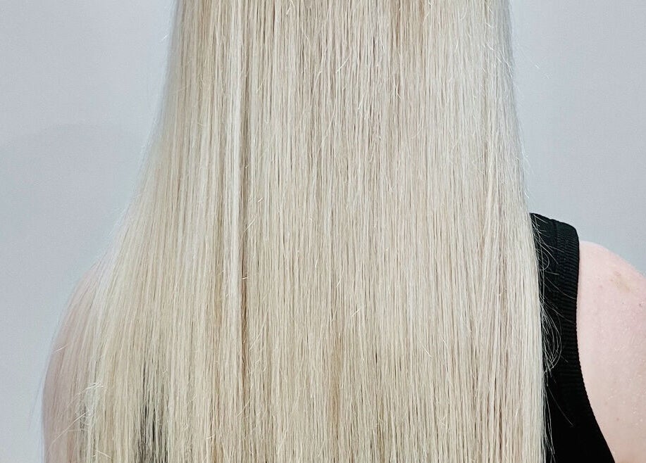 Silky blonde hair view at Sal’s Hair, Mount Peter, Queensland, AU, showcasing expert styling and care.