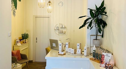 Bright reception at TOV Organic Salon in Tas-sliema, MT with natural decor and beauty products displayed.