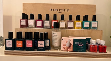 Colorful nail polishes on display at TOV Organic Salon, Tas-sliema, MT, featuring various vibrant shades.