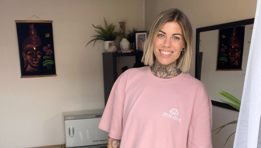 Smiling employee welcomes you at Road Ahead Holistic Therapies, Southampton, England, GB, in a serene setting.