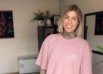 Smiling employee welcomes you at Road Ahead Holistic Therapies, Southampton, England, GB, in a serene setting.