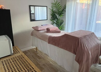 Relaxing therapy room at Road Ahead Holistic Therapies, Southampton, England, GB with massage table and soft lighting.