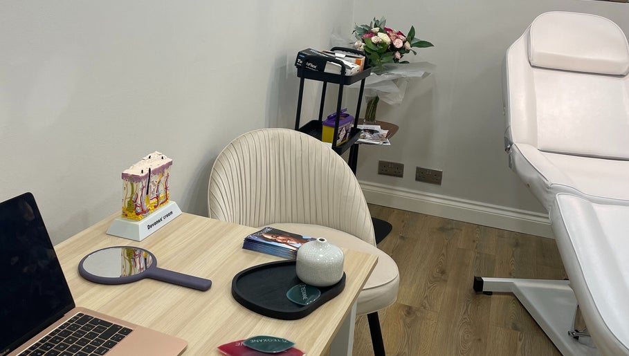 A serene treatment room at InStudio Aesthetics, London, England, GB, featuring a plush chair and beauty tools.