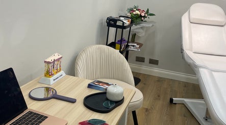 A serene treatment room at InStudio Aesthetics, London, England, GB, featuring a plush chair and beauty tools.