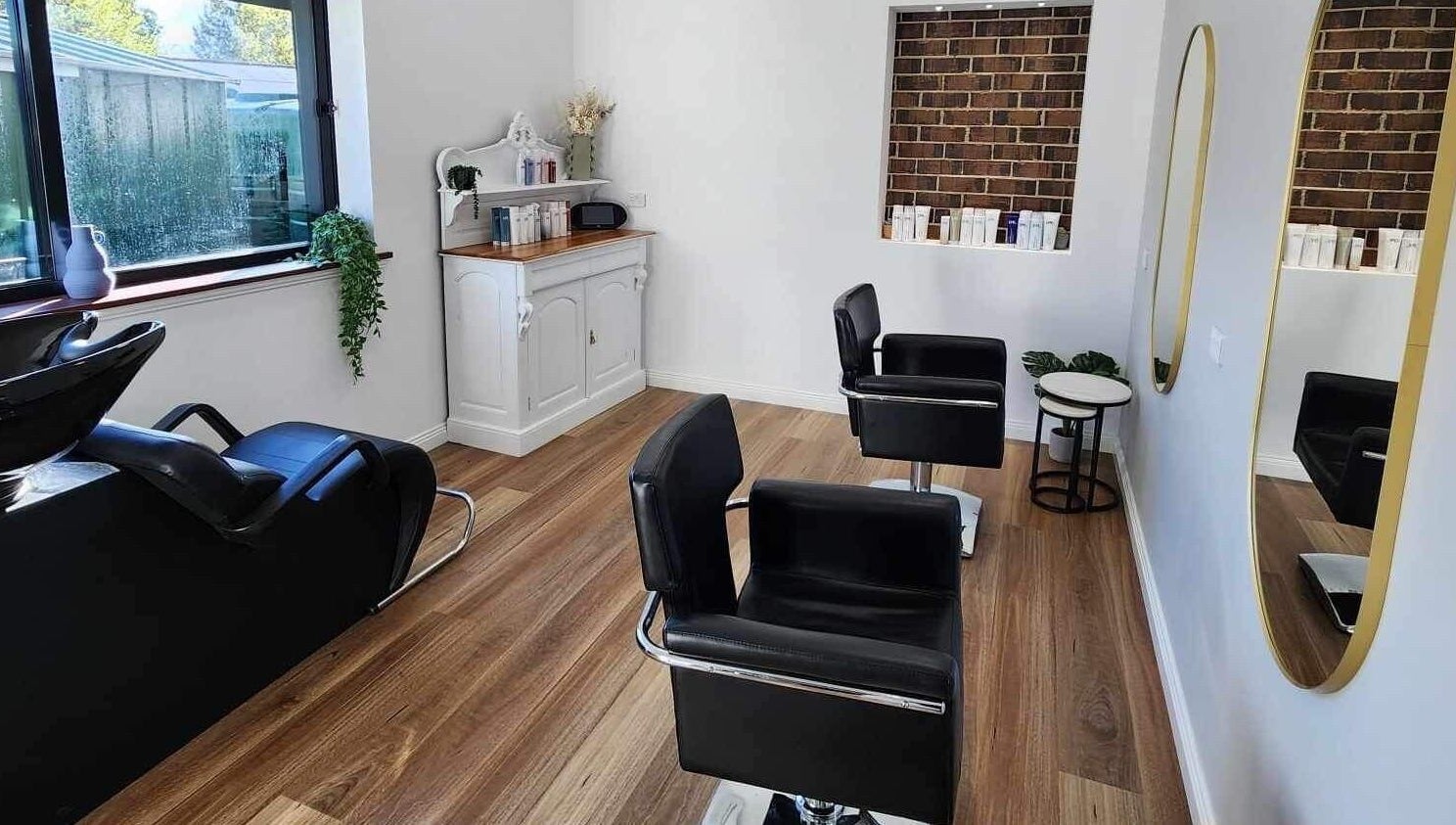 Modern salon interior at Hair by Lily, ACT, Australian Capital Territory, AU with styling chairs and mirrors.