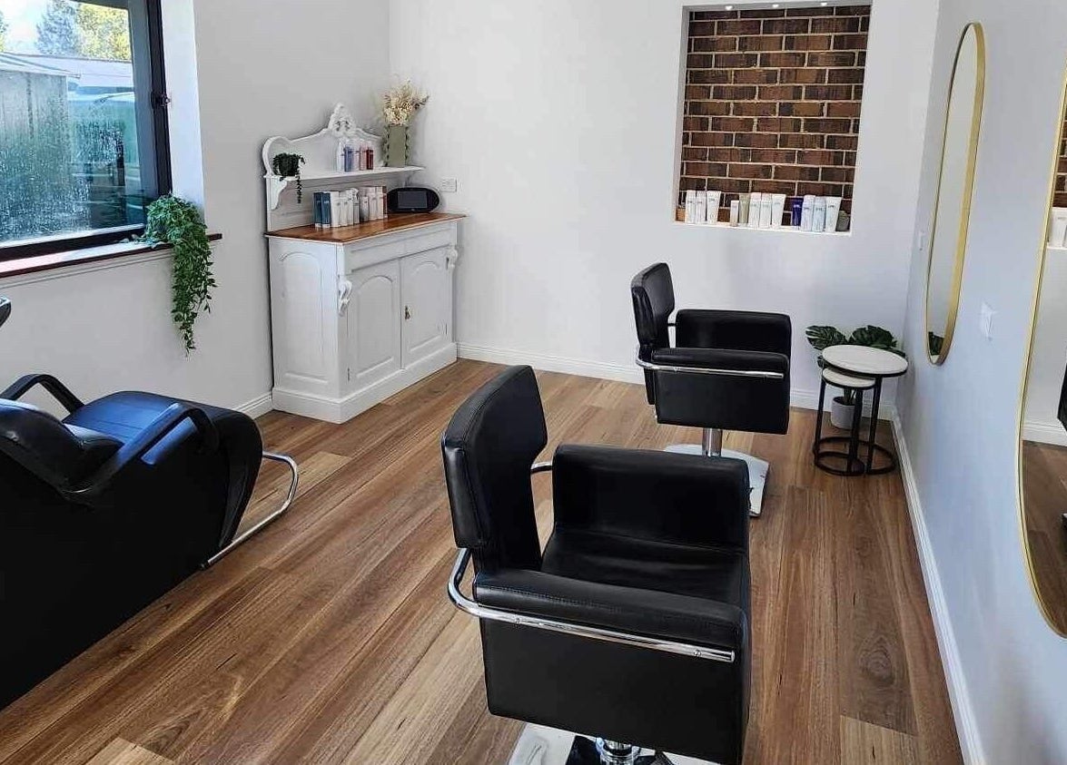 Modern salon interior at Hair by Lily, ACT, Australian Capital Territory, AU with styling chairs and mirrors.