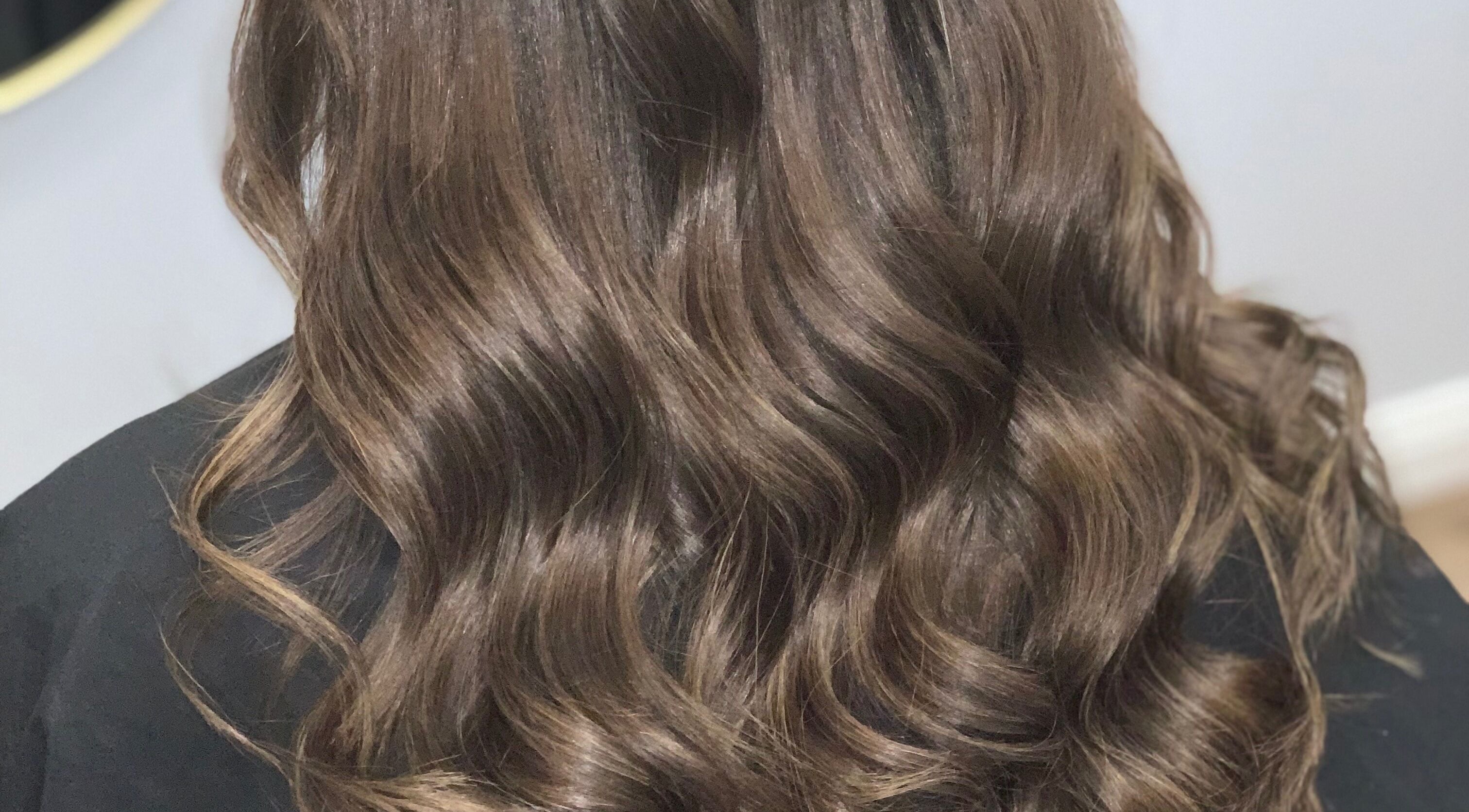 Lustrous wavy hairstyle at Hair by Lily in ACT, Australian Capital Territory, AU.