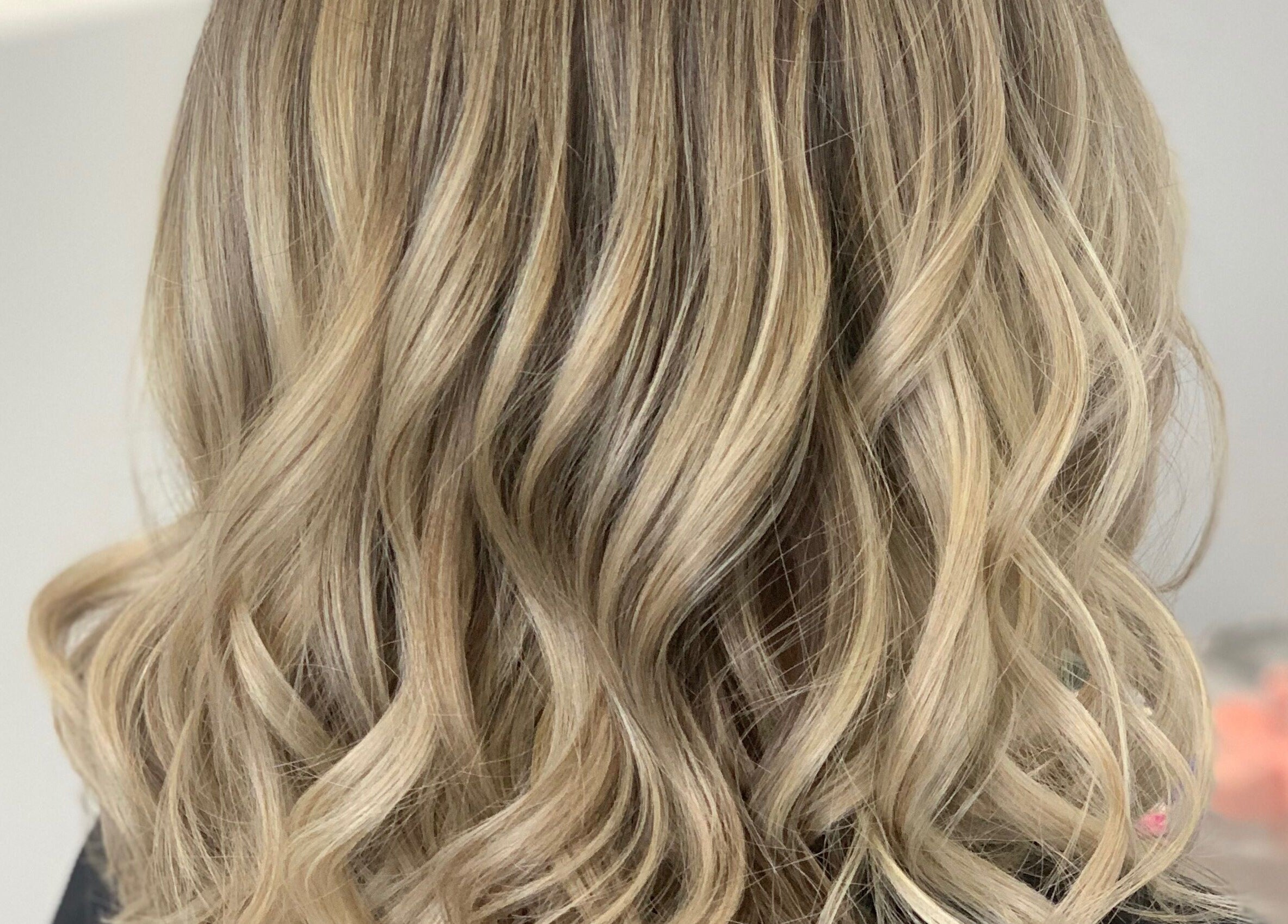 Elegant wavy blonde hairstyle at Hair by Lily, ACT, Australian Capital Territory, AU.