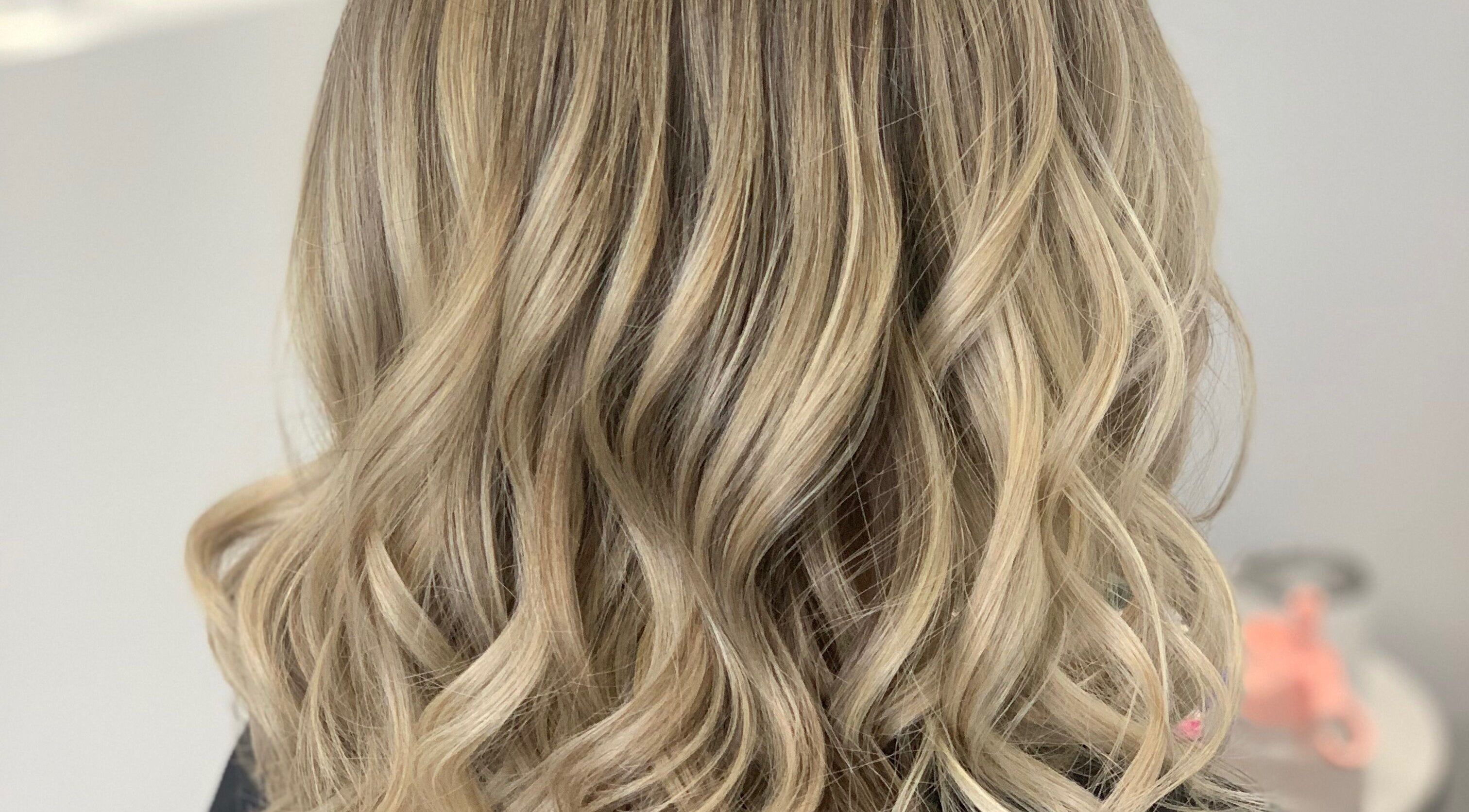 Elegant wavy blonde hairstyle at Hair by Lily, ACT, Australian Capital Territory, AU.