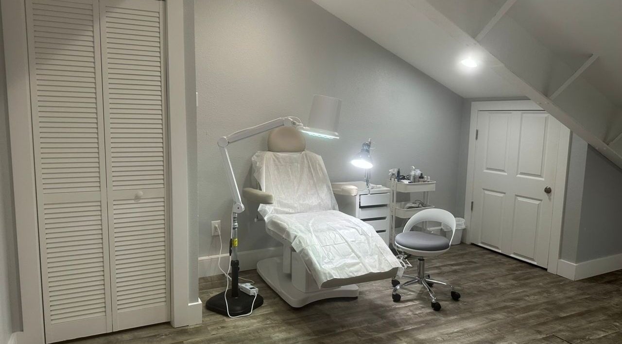 Comfortable treatment chair at Pink Lemonade Beauty Plaza, Key West, Florida, US, under warm lighting.