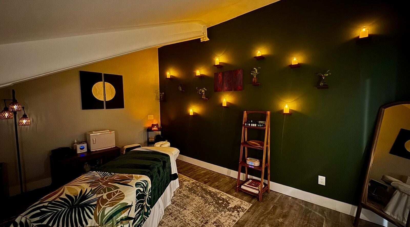 Tranquil massage room at Pink Lemonade Beauty Plaza, Key West, Florida, US, with ambient lighting and decor.