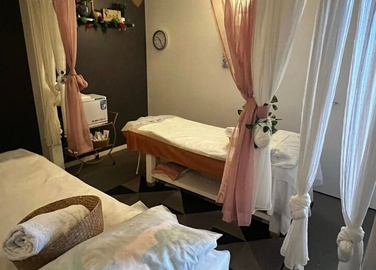 Relaxation room at Flex Beauty and Aroma in Bundall, Queensland, AU, featuring massage beds and gentle lighting.