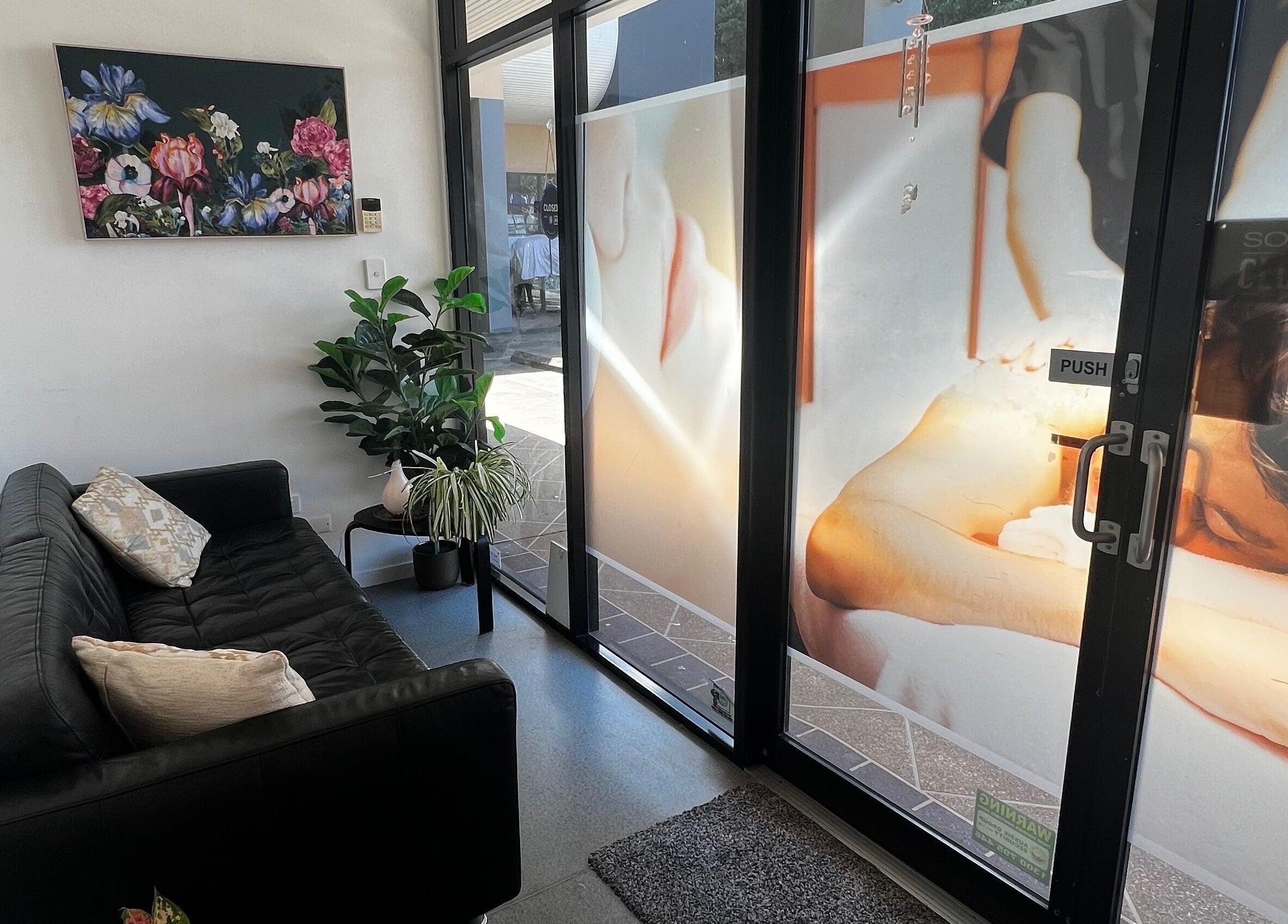 Welcoming lounge at Flex Beauty and Aroma, Bundall, Queensland, AU with cozy seating and vibrant decor.